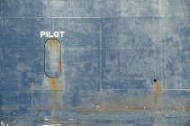 Hull of tanker ship pilot lettering over it — Stock Photo