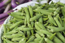Basket of okra at market stall — Stock Photo