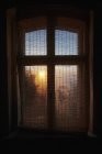 Ethereal sunrise behind gauze window curtain — Stock Photo