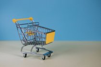 Tiny toy shopping cart — Stock Photo