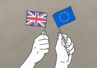 Men waving small British and European Union flags — Stock Photo