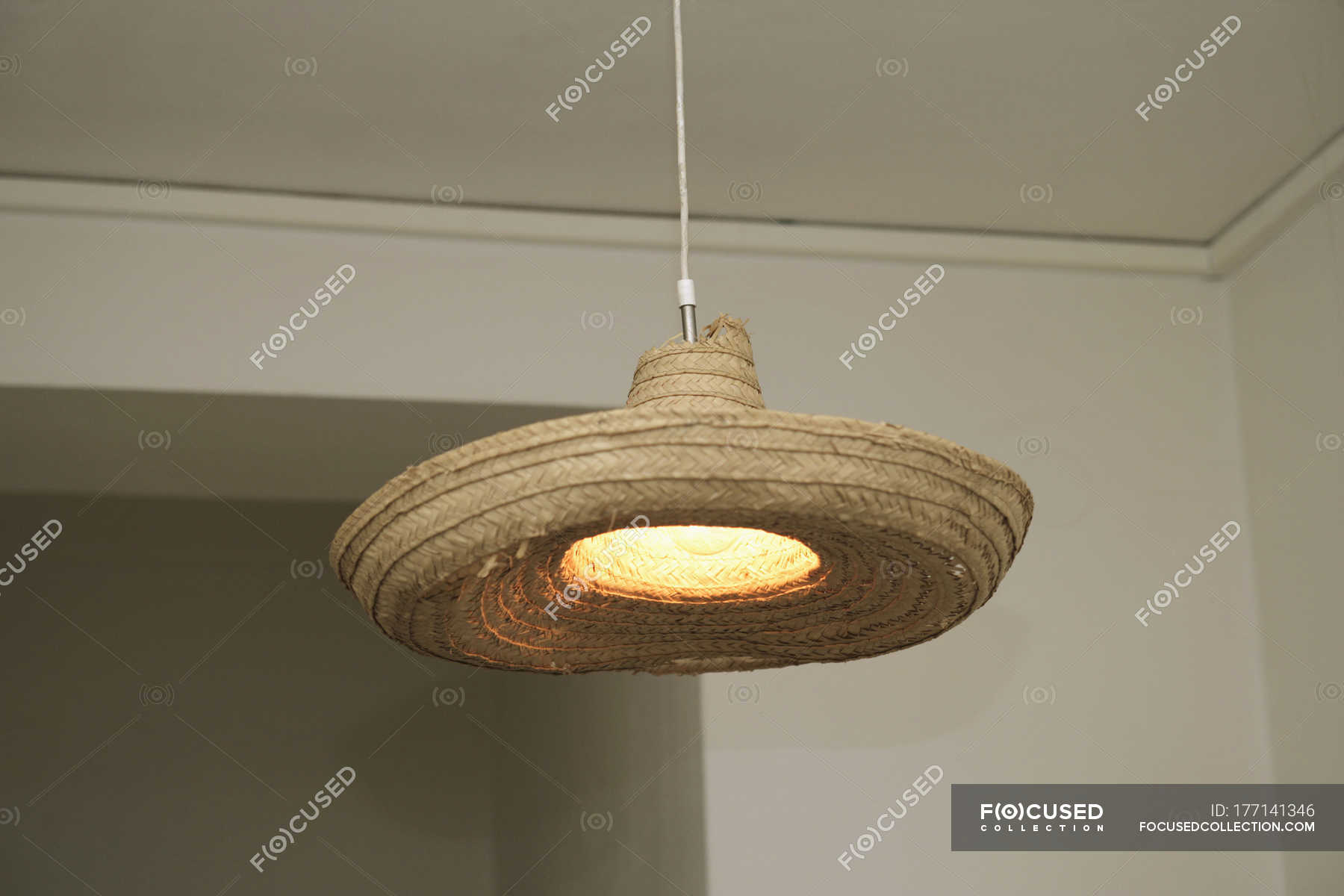 Lighten Lamp Decorated With Straw Hat Single Object Copy Space Lighten Lamp Decorated With Straw Hat Stock Photos