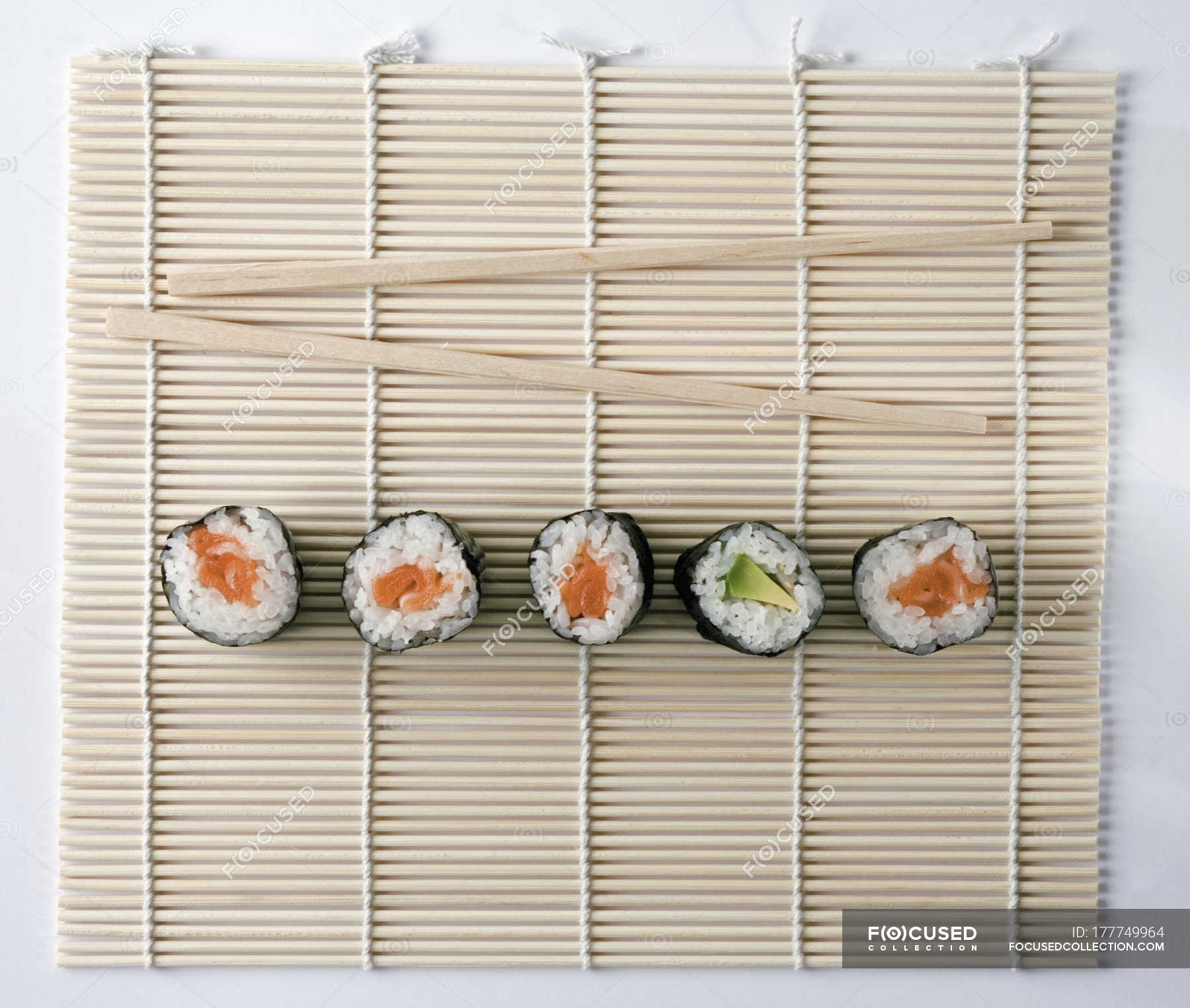 Directly Above View Of Sushi And Chopsticks On Bamboo Mat White