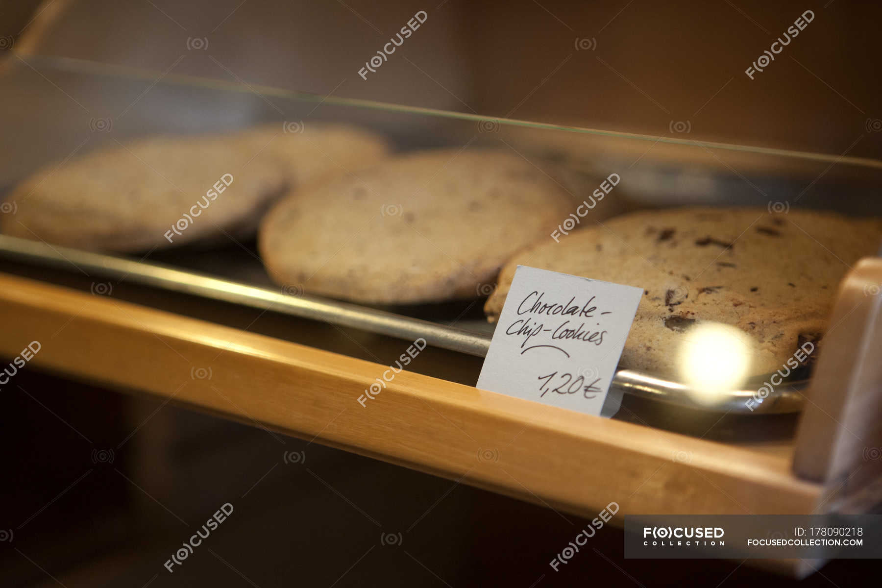 Price Tag On Tray Of Chocolate Chip Cookies In Cafe Display