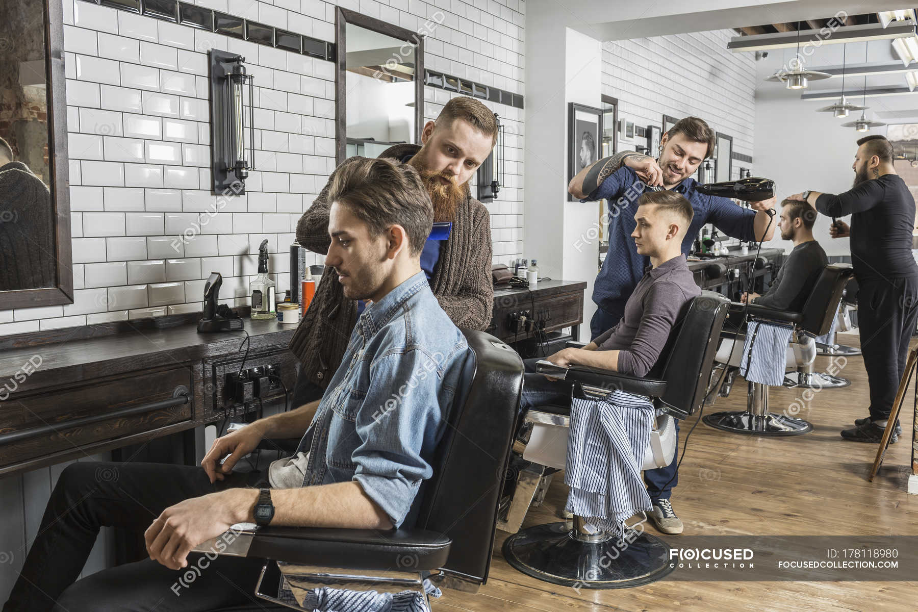 Hairdressers Cutting Male Customer S Hair In Salon Color Image