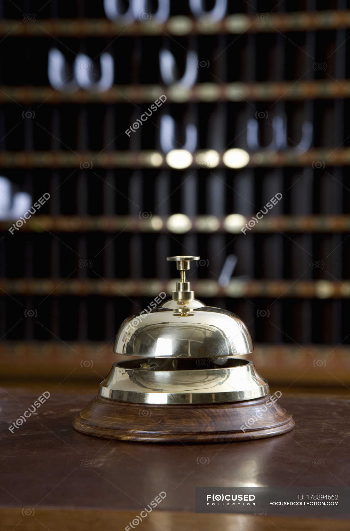 Brass Bell On Desk At Hotel Reception Service Bell Horizontal