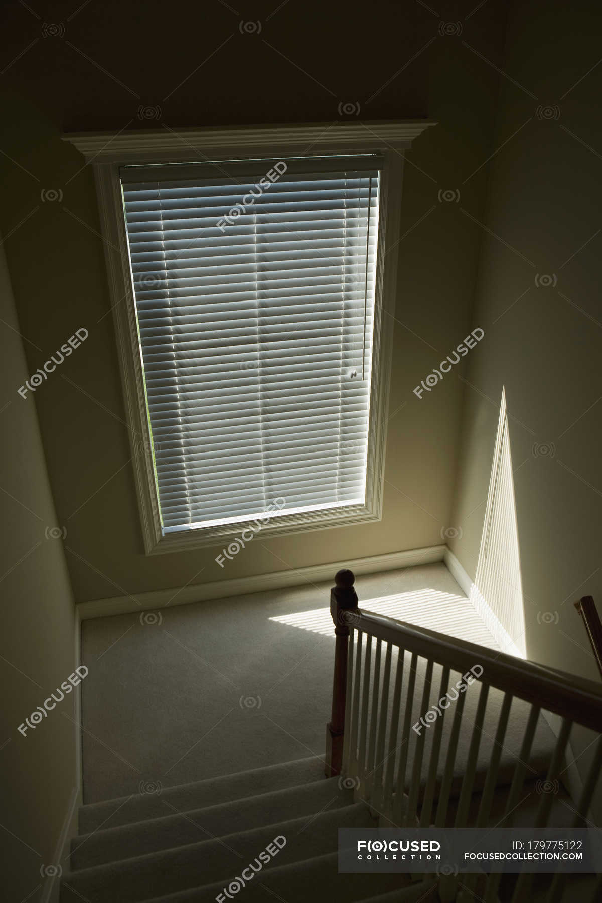 Low Angle View Of Indoor Staircase Window Blinds Shadow Stock Photo 179775122