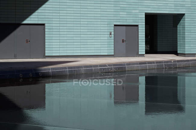 Merge of shapes with water, walls and doors — Stock Photo