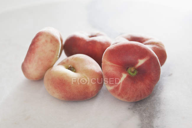 Close up view of ripe peaches on white background — Stock Photo