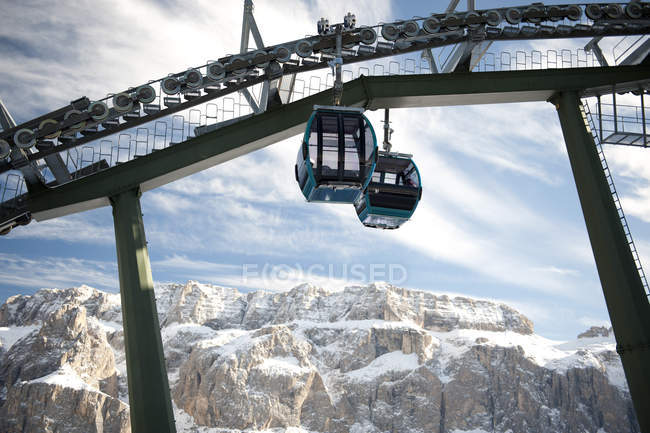 Two ski lifts with rocky mountains in background — Stock Photo