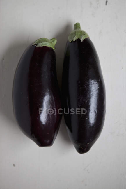 Close up view of two eggplants on table — Stock Photo