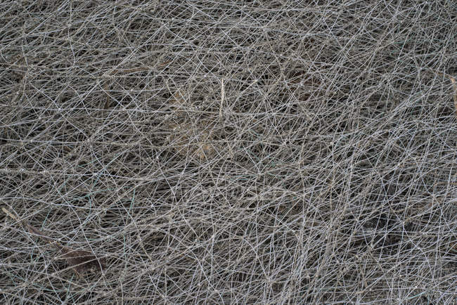 Full frame close up view of tangled fishing net — Stock Photo