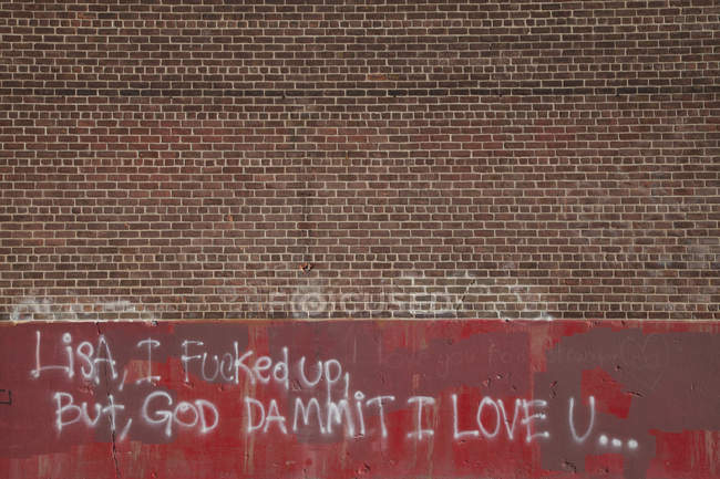 Spray paint love message on wall — Stock Photo