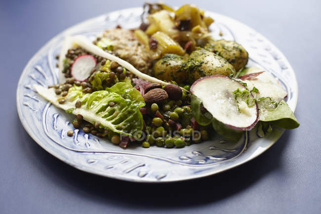 Close up view of fresh food served in plate on table — Stock Photo