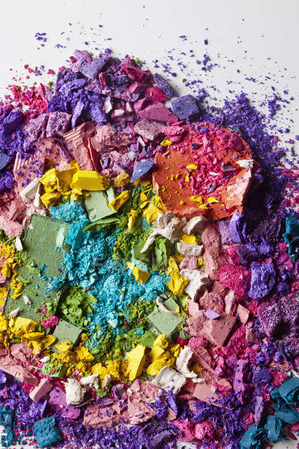 Various crushed up make-up powder products arranged in abstract pattern — Stock Photo
