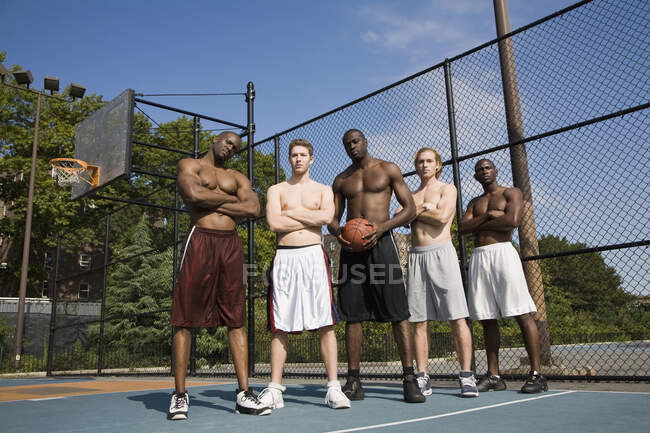 Five basketball players in a row, portrait — Stock Photo