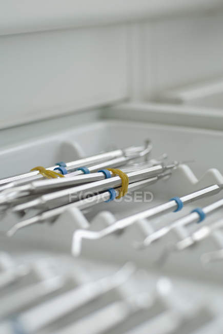 Various dental instruments on metal tray — Stock Photo