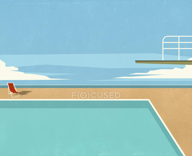 Diving board over swimming pool with ocean view — Stock Photo