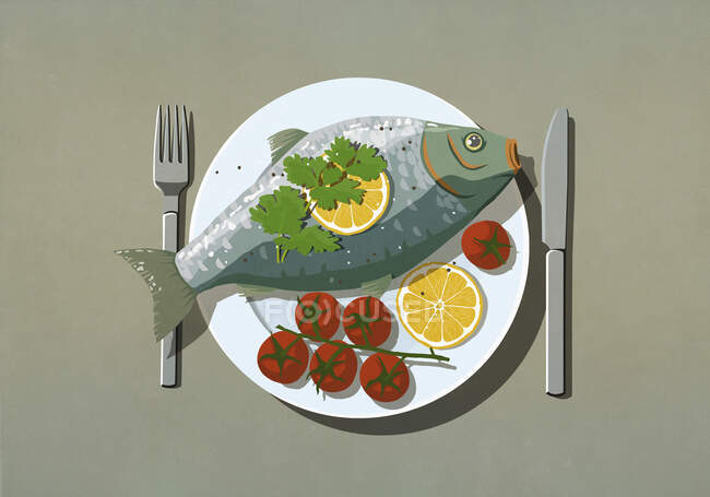 Pescado entero y tomates en el plato - foto de stock
