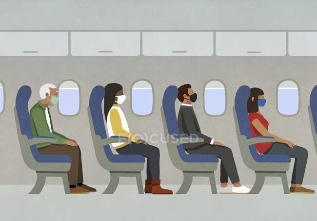 Пассажиры в масках на борту самолета — стоковое фото