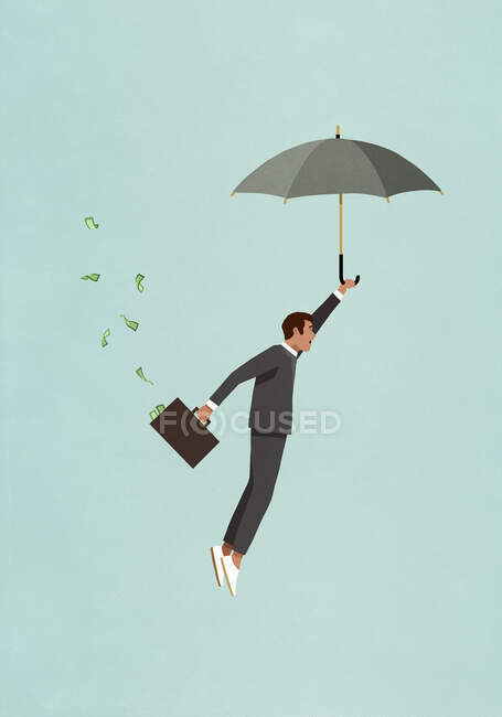 Inversor masculino con paraguas y maletín de dinero volando - foto de stock