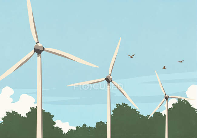 Птахи літають над вітровими турбінами. — стокове фото