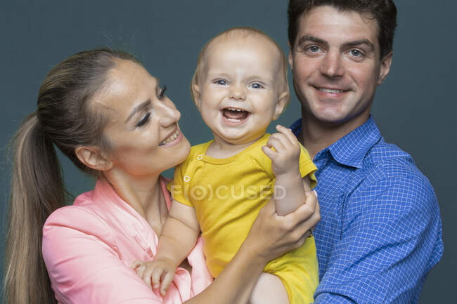 Portrait happy baby boy and parents — Stock Photo