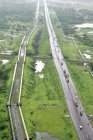 An aerial view of highway running between Mumbai and Kalyan on the outskirts of Mumbai, Maharashtra, India. — Stock Photo
