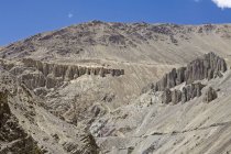 Erosion over centuries has created interesting sclptures in the sandy mountains of the cold desert landscape of Ladakh. India — Stock Photo