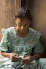 Rural indian girl stitch torn cloths. Salunkwadi, Ambajogai, Beed, Maharashtra, India — Stock Photo