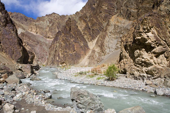 A stream cutting across the rocky mountains of Ladakh. India — Stock Photo