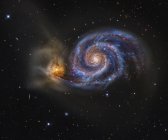 M51 and Whirlpool galaxies in gravitational embrace — Stock Photo
