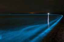 Bioluminescence in waves of Gippsland lake — Stock Photo