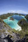 Rugged limestone islands with lagoon — Stock Photo