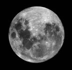Luna piena su nero — Foto stock