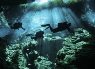 Divers in cavern system — Stock Photo