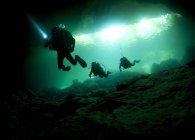 Cavern divers entering cenote — Stock Photo