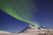 Aurora borealis over Ogilvie mountains — Stock Photo