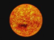 Stella arancione Sole su nero — Foto stock