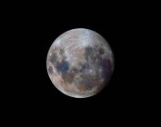 True colors of moon during 2010 perigee on black background — Stock Photo