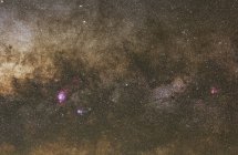 Milky Way from Lagoon Nebula to Omega Nebula including red and blue Trifid nebula — Stock Photo
