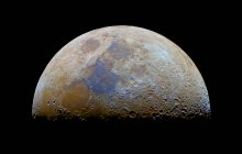 Moon in colors with transient Lunar-X feature on black background — стоковое фото