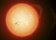 Sun with visible dark sunspots on surface in outer space — Stock Photo