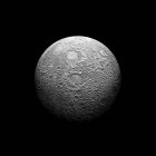 Heavily cratered moon in high resolution on black background — Stock Photo