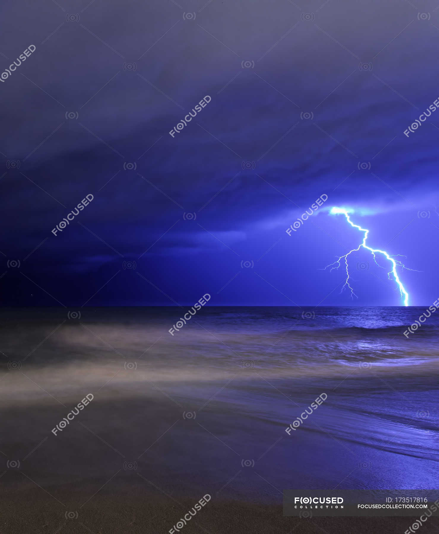 bolt-of-lightning-from-approaching-storm-danger-colors-stock-photo