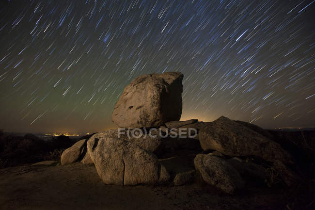 Star trails and large boulders — Stock Photo