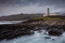 Lighthouse just after sunset with the light on — Stock Photo