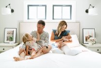 Family of a mom, dad, toddler daughter and newborn baby — Stock Photo