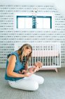 Portrait of beautiful happy mother and her baby son at home — Stock Photo