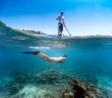 Young couple have fun in the ocean, underwater view — Stock Photo